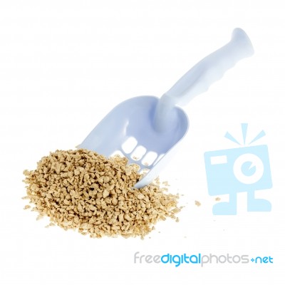 Plastic Scoop For Cleaning Cat Litter And A Pile Of Filler On A Stock Photo