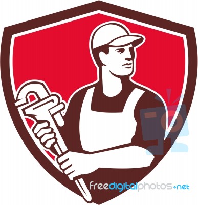 Plumber Wielding Monkey Wrench Shield Retro Stock Image