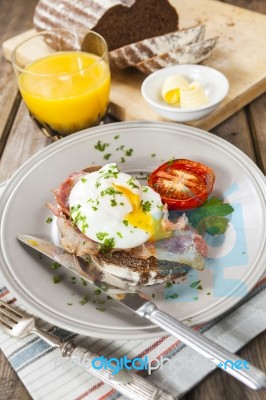 Poached Egg And Bacon On Rye Bread, Healthy Breakfast Stock Photo