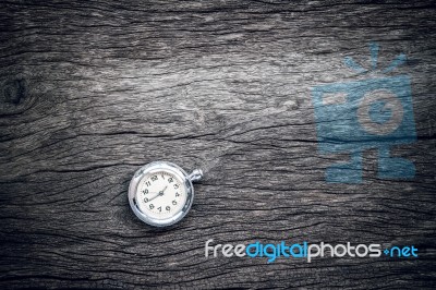 Pocket Watch On Old Wooden Background Stock Photo