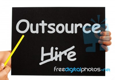 Pointing Outsource On Blackboard Stock Photo