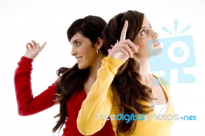 Pointing Young Women Stock Photo