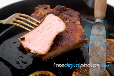 Pork Chop Seared On Iron Skillet Stock Photo