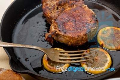 Pork Chop Seared On Iron Skillet Stock Photo