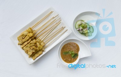 Pork Satay With Cucumber Salsa And Peanut Sauce Stock Photo