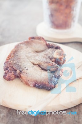 Pork Steak On Wooden Plate Stock Photo