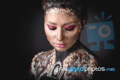 Portrait A Girl With Golden Icon Painting Makeup Stock Photo