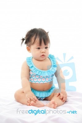 Portrait Baby Girl In Swimsuit On White Background Stock Photo