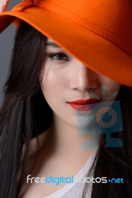 Portrait Close Up Of Beautiful Asian Woman Model In Orange Strip… Stock Photo