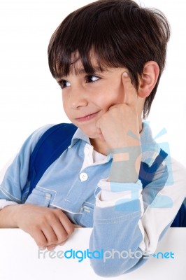Portrait Of A Adorable School Boy Thinking Stock Photo