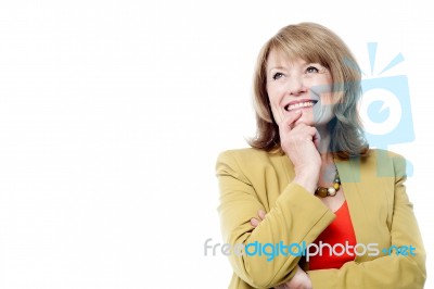 Portrait Of A Beautiful Thoughtful Woman Smiling Stock Photo