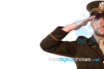 Portrait Of A Patriotic Soldier Saluting Stock Photo