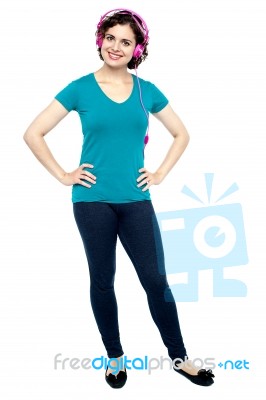 Portrait Of A Stylish Woman Using Headphones Stock Photo