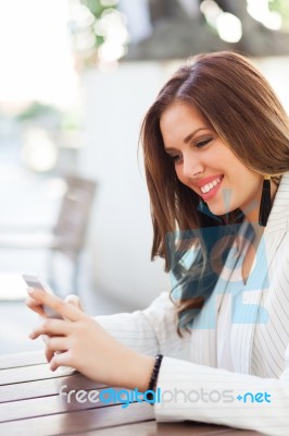 Portrait Of A Young Woman Using A Cellphone Stock Photo