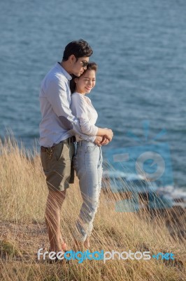 Portrait Of Asian Younger Man And Woman Relaxing Vacation At Sea Side Happiness Emotion Stock Photo