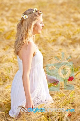 Portrait Of Beautiful Girl In Field Stock Photo