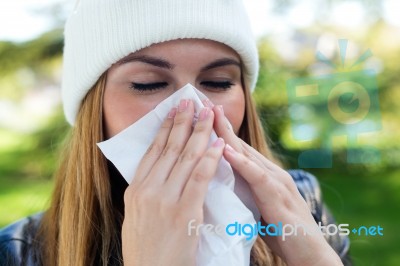 Portrait Of Beautiful Girl With Tissue Having Flu Or Allergy Stock Photo