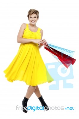 Portrait Of Beautiful Young Woman Carrying Shopping Bags Stock Photo