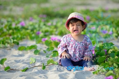 Portrait Of Crying Sad Baby Girl Is On Playground Stock Photo