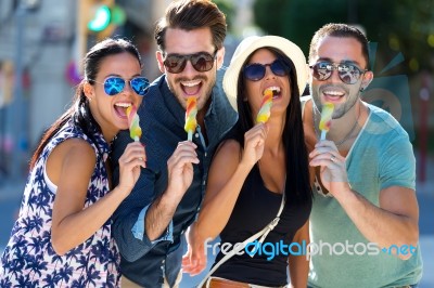 Portrait Of Group Of Friends Eating Ice Cream Stock Photo