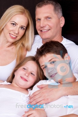 Portrait Of Happy Family Posing Towards The Camera Stock Photo