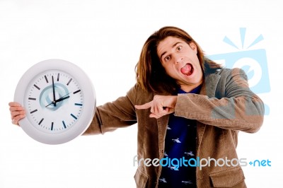 Portrait Of Man Indicating Watch Stock Photo