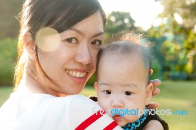 Portrait Of Mother And Babies Stock Photo