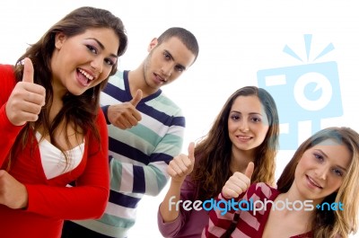 Portrait Of Smiling People With Thumbs Up Stock Photo
