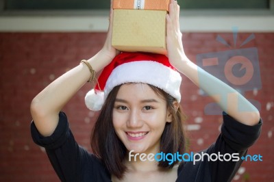 Portrait Of Thai Adult Student University Beautiful Girl Hold Gift Box In Hands Stock Photo