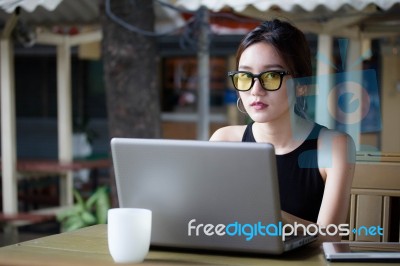 Portrait Of Thai Adult Student University Beautiful Girl Using Her Laptop Stock Photo