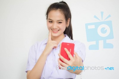 Portrait Of Thai High School Student Uniform Beautiful Girl Using Her Smart Phone Selfie Stock Photo