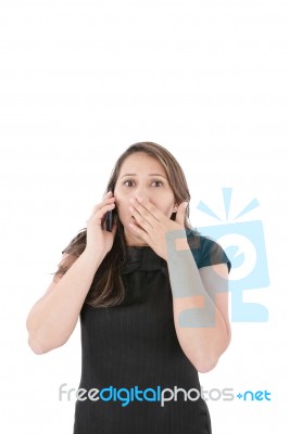 Portrait Of Woman Making A Phone Call Against A White Background… Stock Photo