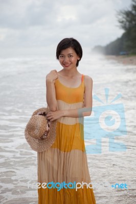 Portrait Of Young Asian Woman Wearing Long Dress With Smiling Fa… Stock Photo