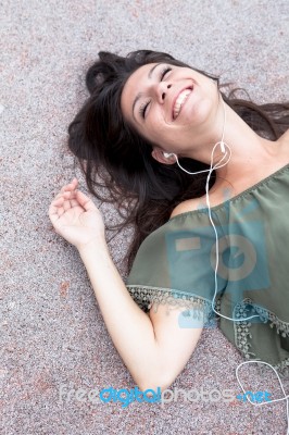 Portrait Of Young Girl Listening To Music Stock Photo