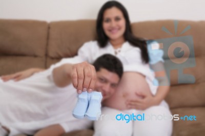 Portrait Of Young Pair Showing A Pair Of Socks Waiting For The N… Stock Photo