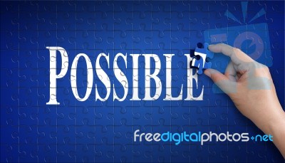 Possible Word On Jigsaw Puzzle. Man Hand Holding A Blue Puzzle T… Stock Photo