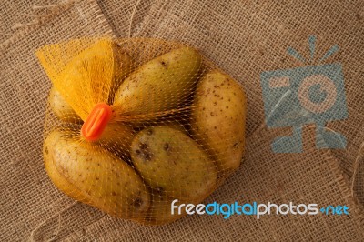 Potato Still Life On Sack Background Flat Lay Stock Photo