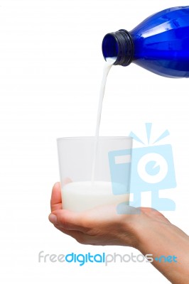 Pouring Milk In Glass Stock Photo