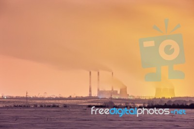 Power Plant And Cooling Towers At Dusk Stock Photo