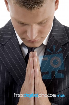 Praying Young Businessman Stock Photo