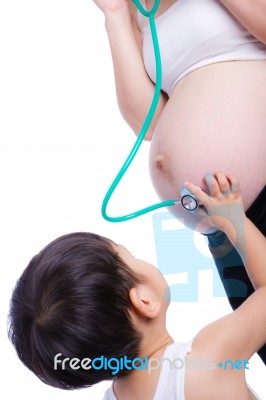 Pregnant Woman Examining Her Tummy Stock Photo