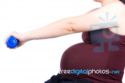 Pregnant Woman Exercising With Dumbbell Stock Photo