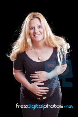 Pregnant Woman Holding Tummy Stock Photo