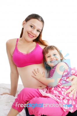 Pregnant Woman With Her Daughter Stock Photo