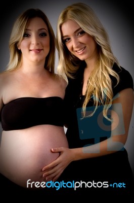 Pregnant Woman With Her Sister Stock Photo