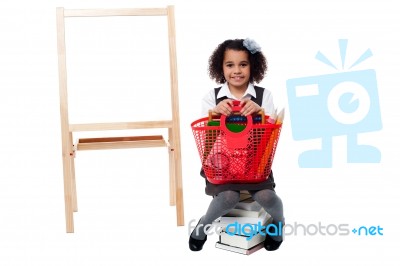 Pretty Child Posing With Basket Stock Photo
