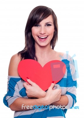 Pretty Girl Holding A Red Heat Stock Photo