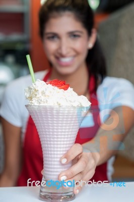 Pretty Girl Serving Strawberry Shake Stock Photo