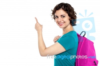 Pretty Student Indicating Towards Copy Space Area Stock Photo