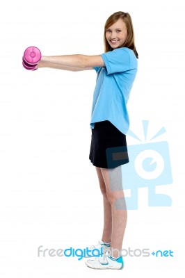 Pretty Teen Working Out With Pink Dumbbells Stock Photo